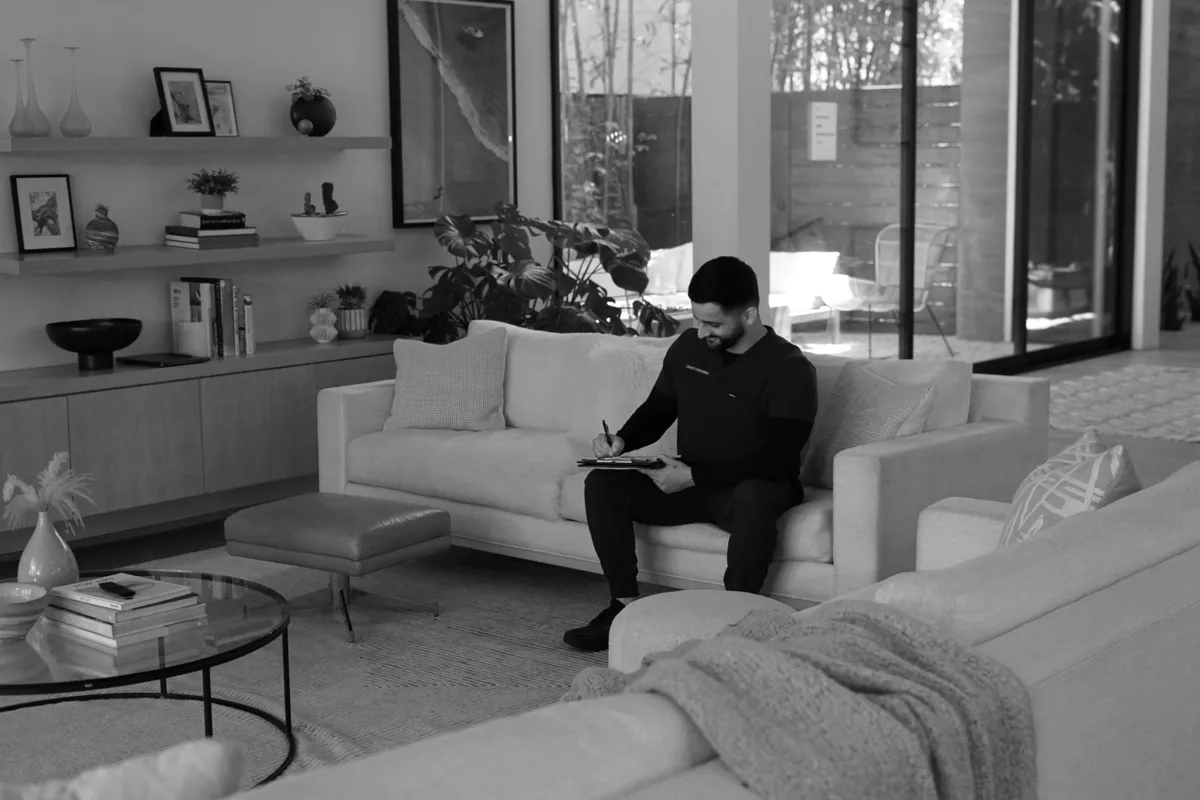 Healthcare professional reviewing documents in a modern living room